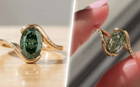Oval green diamond ring with curved yellow gold band and small accent diamonds on a modern designer setting.